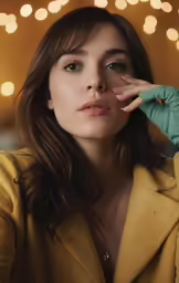 a girl looking at the camera with lights behind her