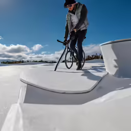 the man is getting ready to ride his bike