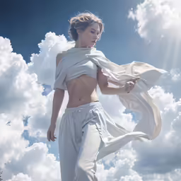 a woman in white clothing walking up stairs