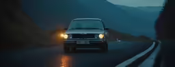 a car driving down a road at night