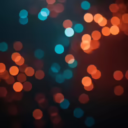 several colored lights in the dark on a table