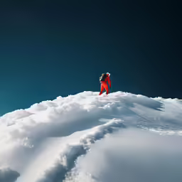 a man on skis coming down a snow covered mountain