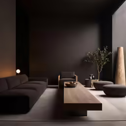 a living room with black walls and furniture
