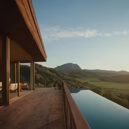 there is a wooden deck next to a very long pool