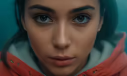 a close up view of the face and shoulders of an adult woman