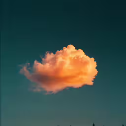 there is an orange cloud in the sky