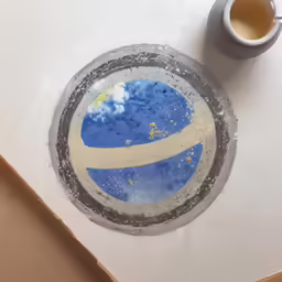 a coaster with the letter b written on it in cement