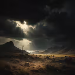 there is a cloudy sky and sun shining over the land