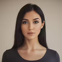 the woman is posing for a portrait in front of a brown wall