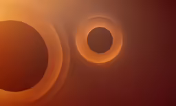 two circles are shown with a light behind them