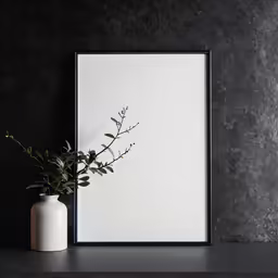 an empty square framed art print on a black wall