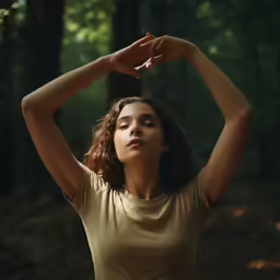 a woman that is looking up in the air