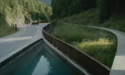 a small swimming pool sitting next to the road