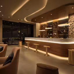 the modern bar looks incredible in this lobby