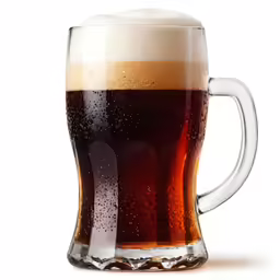a beer glass filled with dark beer on top of a white background