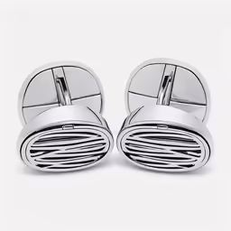 a pair of chrome cufflinks on a white background