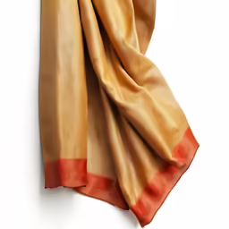 the tan scarf is hanging against a wall