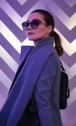 woman in blue blazer carrying a bag, on top of her head