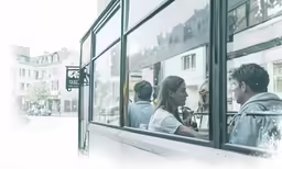 people are standing outside the window looking at something