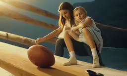 two little girls playing with a basketball