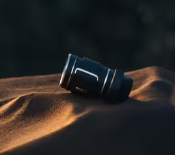 there is a camera on top of sand
