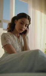 woman with telephone hands up looking forward in room