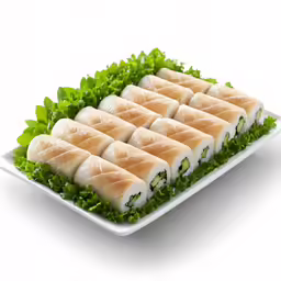 a plate filled with food with lots of lettuce on it