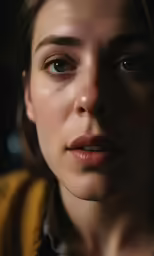 a beautiful young woman looking up at the camera
