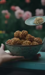 there is a spoon full of cereal bites in a bowl