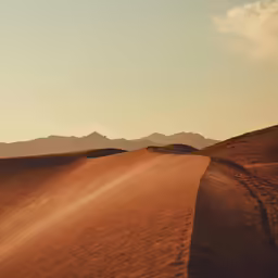 a view from the back end of a car traveling on a desert road