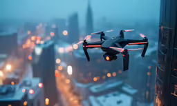 the black and white quad camera flying over a city