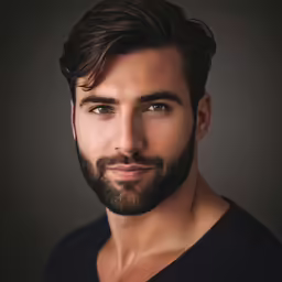 a man that has a beard and shirt on