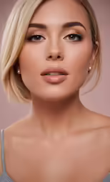 a blonde model with natural makeup on an off - white background