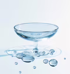 a glass bowl with a few drops of water around it