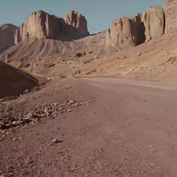 a car is driving down an empty road