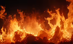 a large fire blazing in an open space