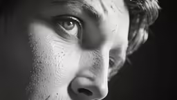 close up of a boy with white paint on his face