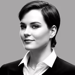 a woman with short hair wearing a jacket