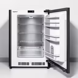 a open refrigerator in the middle of an empty room