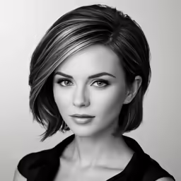a woman is posing for a black and white photo