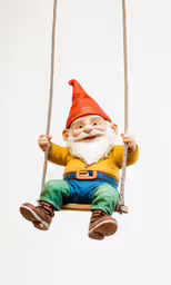 gnome sitting on swing suspended from rope