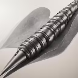 a sculpture of a long pointed object on a surface