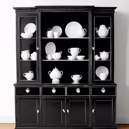 an image of a black china cabinet with white china