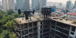 two cameras mounted to the roof of an apartment building