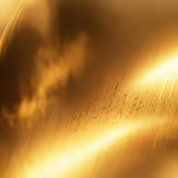 a golden metallic object with black and yellow