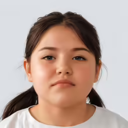 a girl looks ahead with a smirk on her face