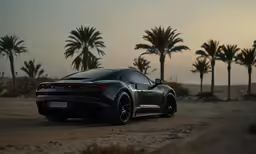 a black sports car in the middle of the desert