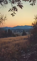 a sunset with the mountains behind it