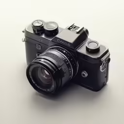 an old black camera with the lens attached to the front