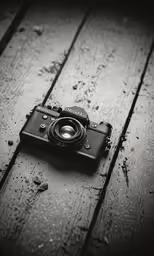 a camera sitting on top of a wooden floor